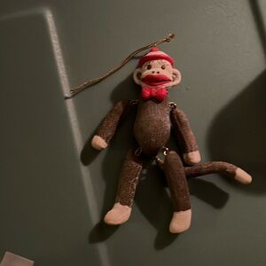 NWOT ceramic sock monkey ornament
